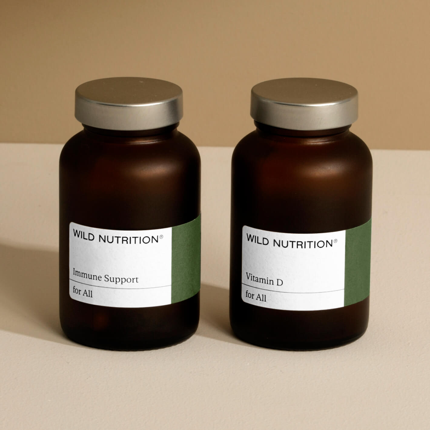 Wild Nutrition Immune Support Duo with Vitamin D in amber glass bottles for health and wellness.