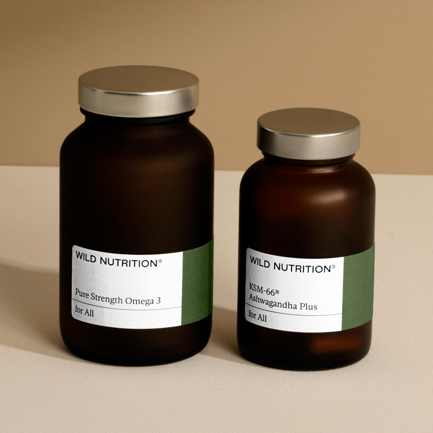 Wild Nutrition Pure Strength Omega 3 and KSM-66 Ashwagandha Plus bottles on a neutral background.