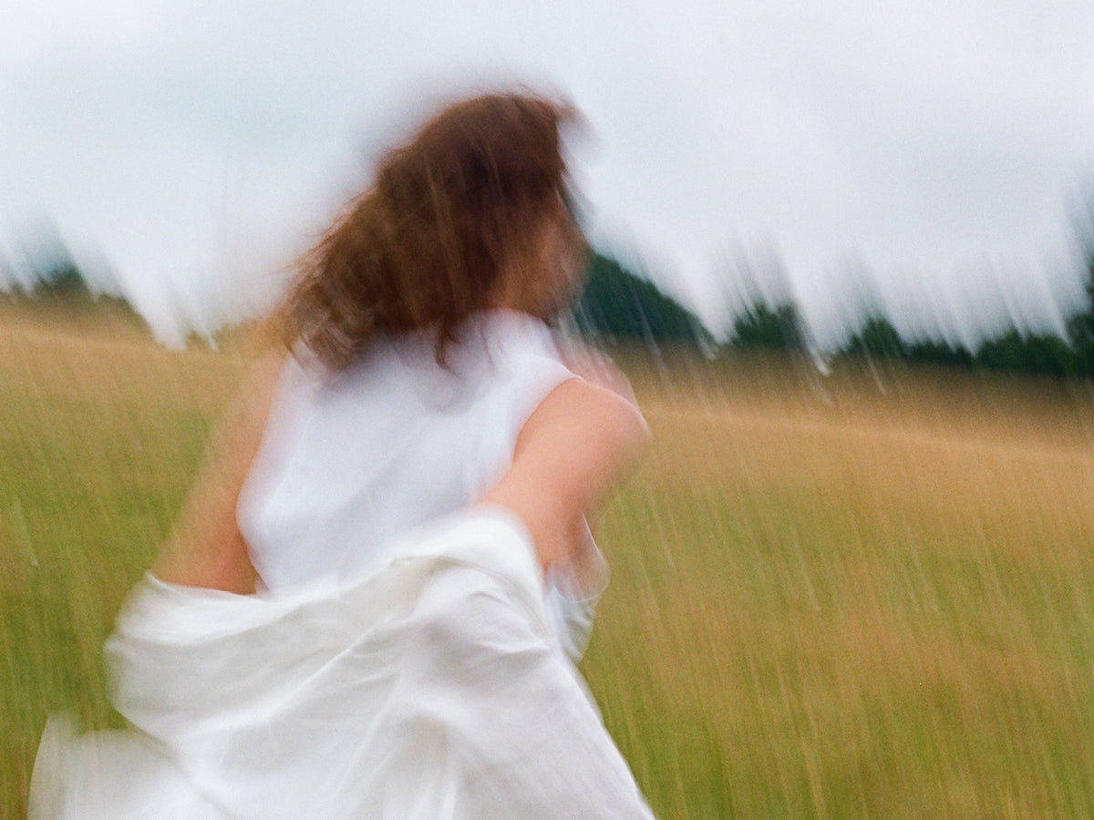 Woman from Wild Nutrition running through a field