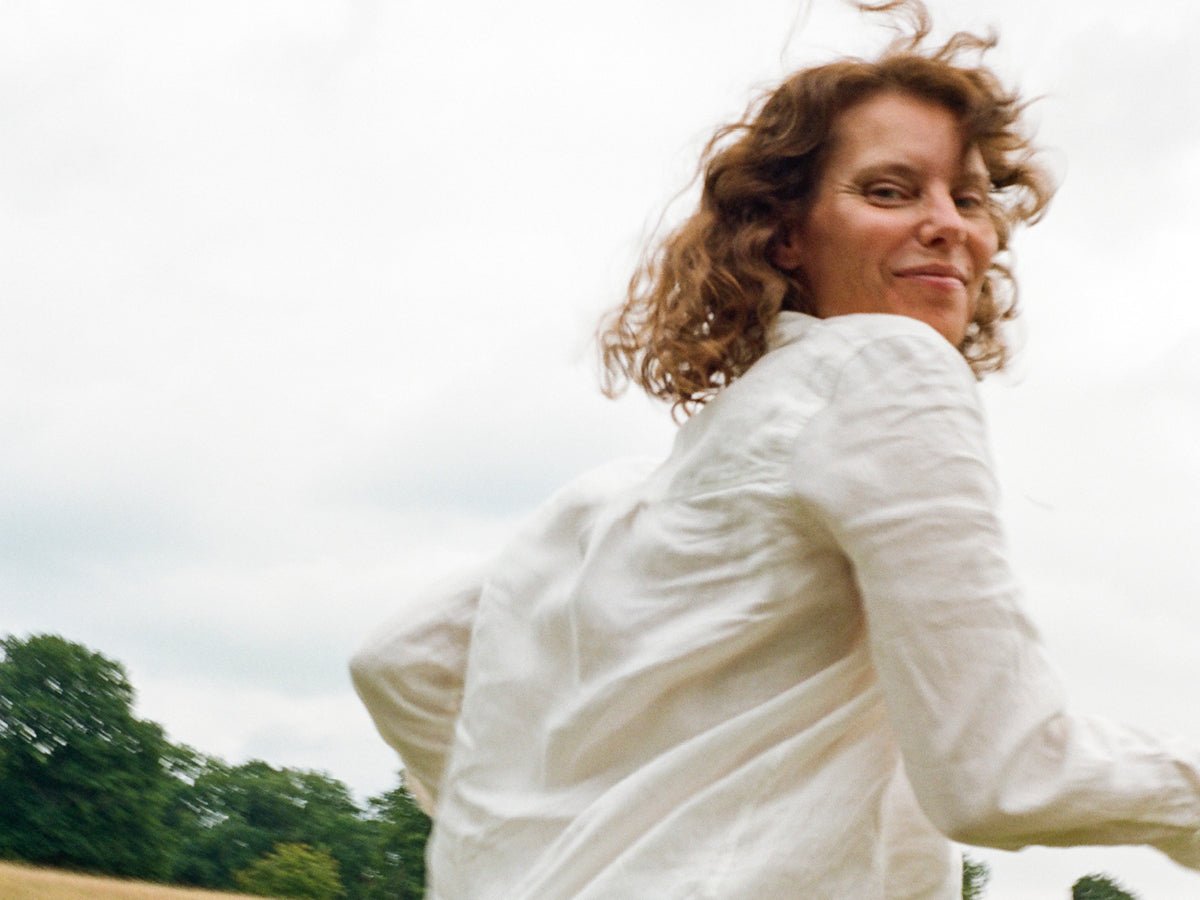 Photo of a woman from Wild Nutrition running in a field