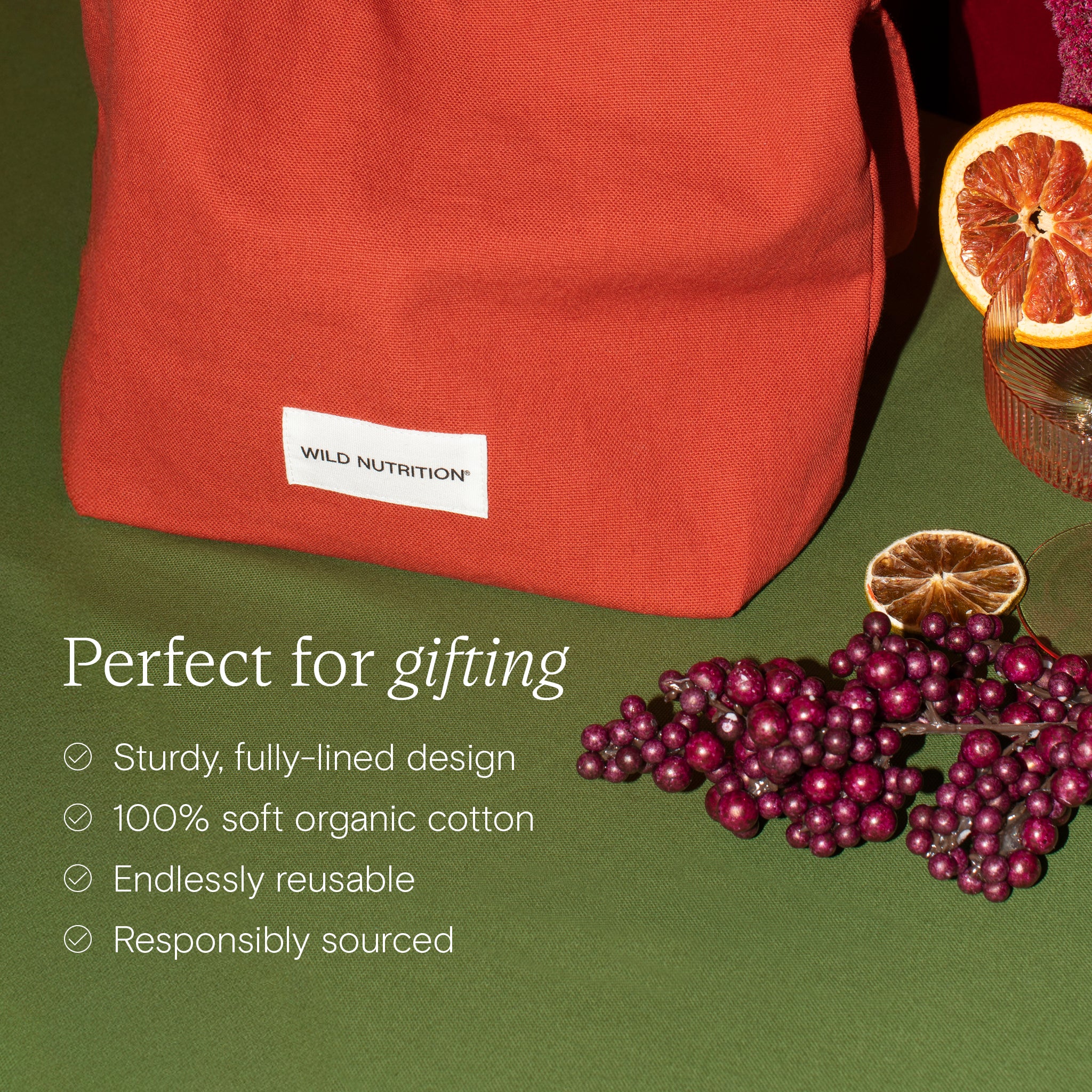 Red bag with a Wild Nutrition label on a green background with berries and an orange slice.