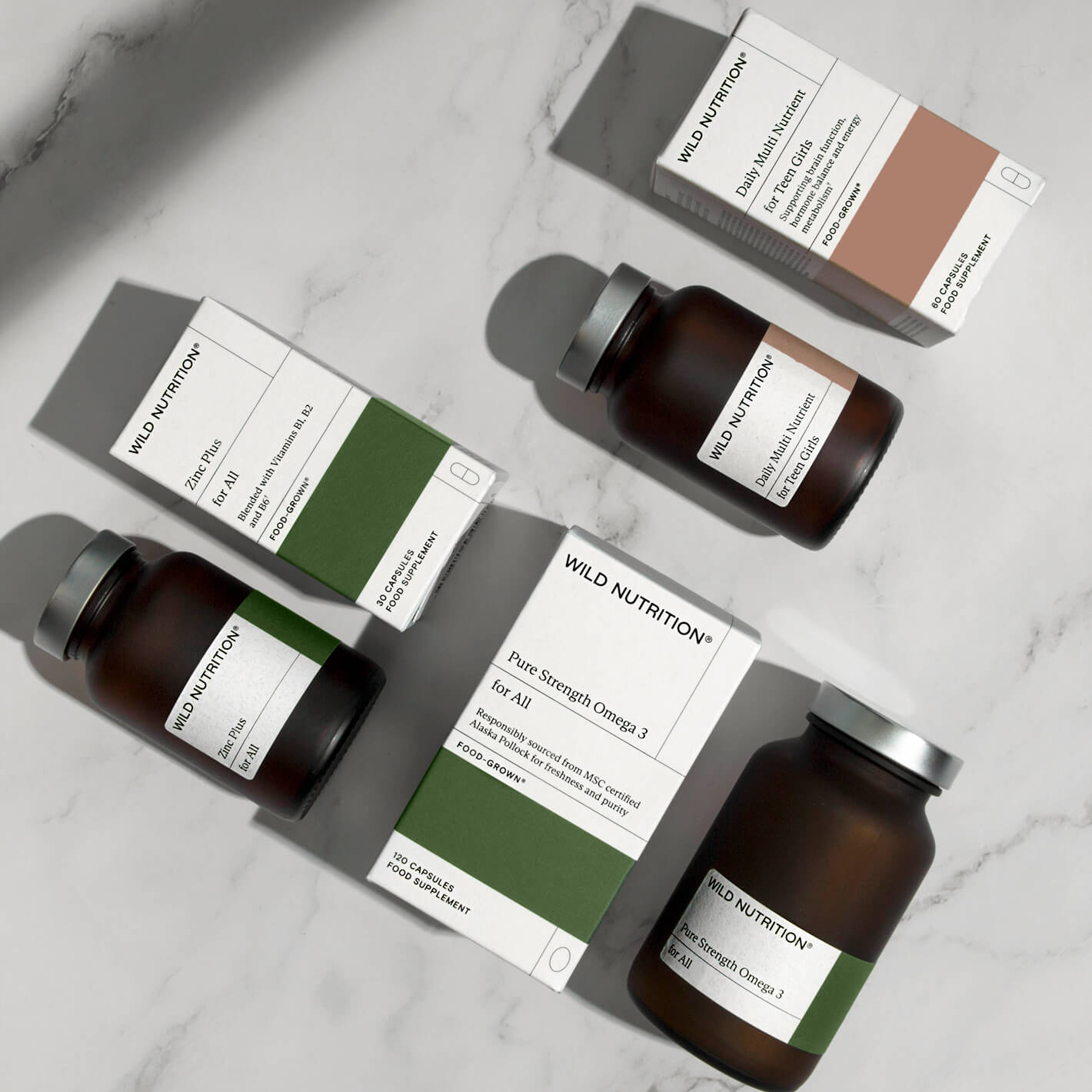 Wild Nutrition wellness trio for teen girls, featuring bottles and boxes of supplements for hormone health and energy support.